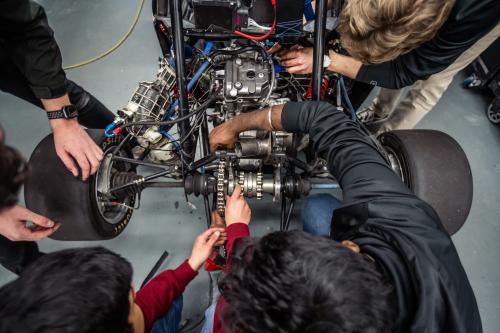 Students work on a competition vehicle in the SAE garage at ϲʷ¼
