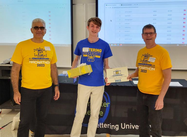 From left, Dr. Babak Elahi, Dean of the College of Sciences and Liberal Arts, Noah Gedraitis, second-place winner and Dr. Michael Farmer, Head of the Department of Computer Science at ϲʷ¼.
