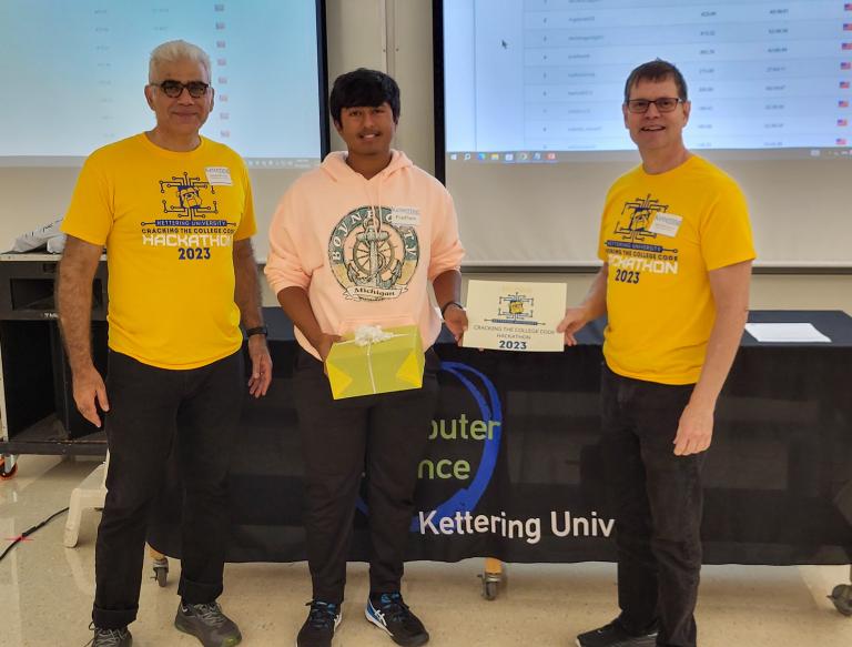 From left, Dr. Babak Elahi, Dean of the College of Sciences and Liberal Arts, Pradham Kuchipudi, fourth-place winner and Dr. Michael Farmer, Head of the Department of Computer Science at ϲʷ¼.