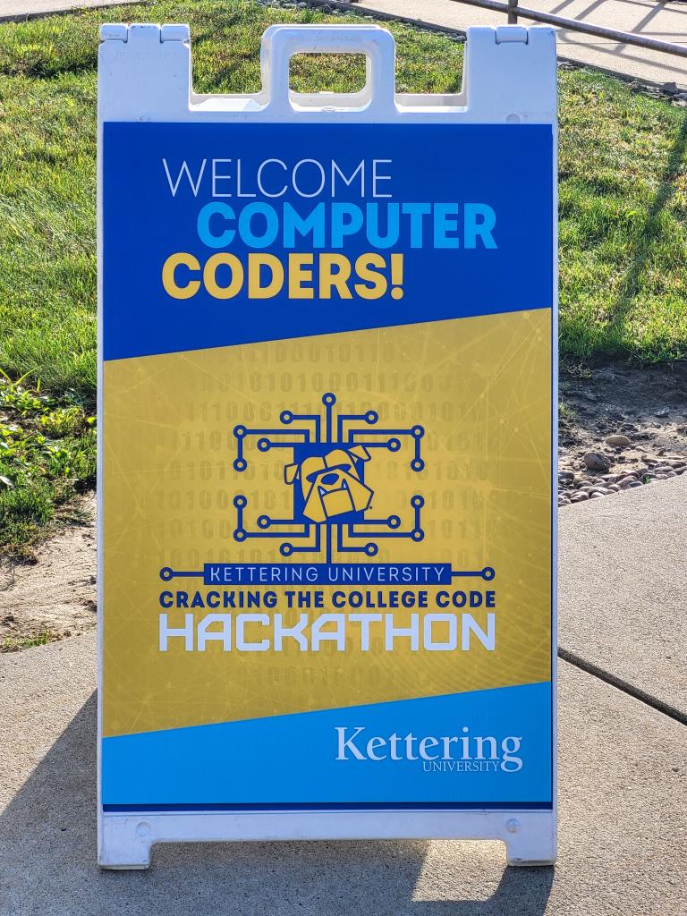 A sign outside of ϲʷ¼ that reads, "Welcome Computer Coders!"